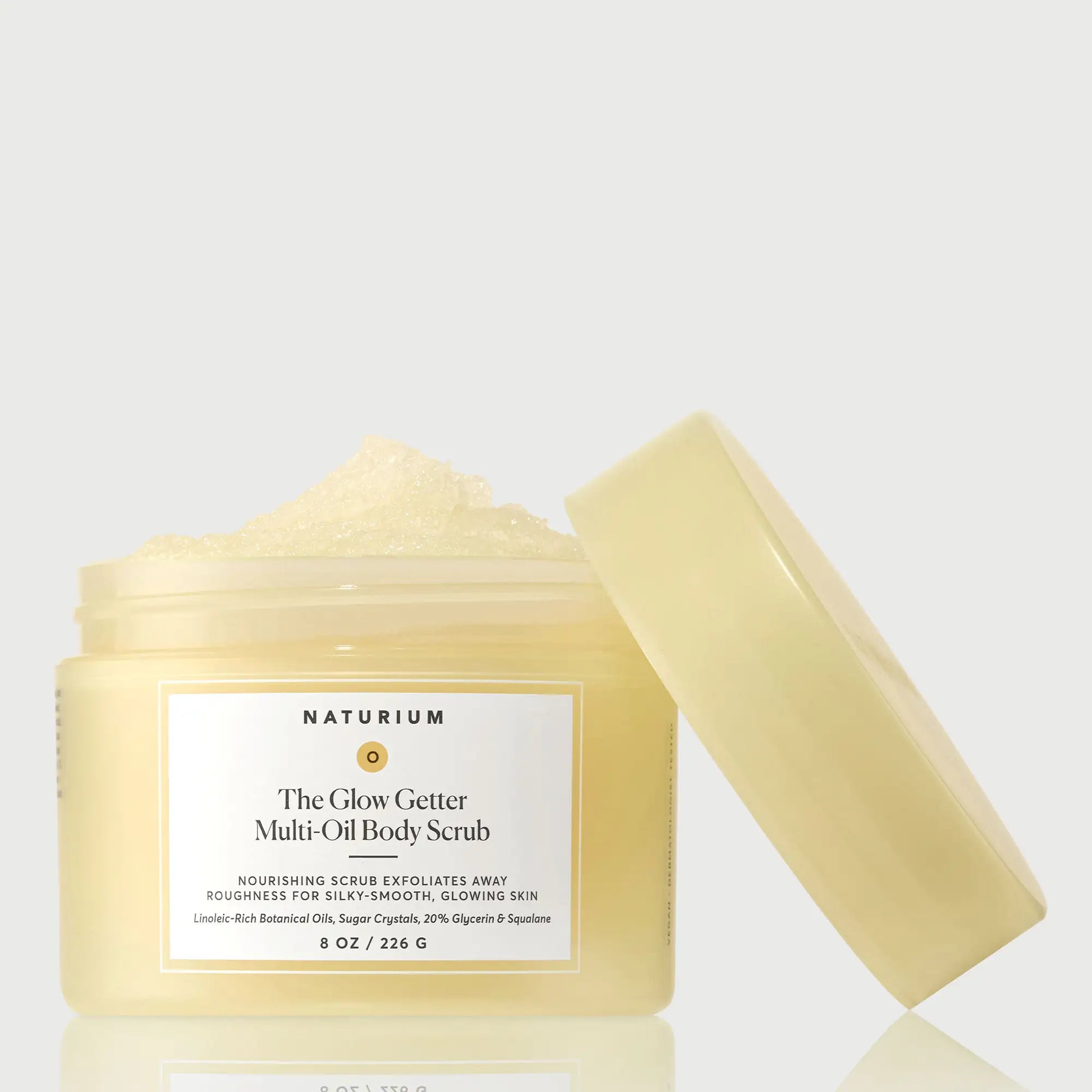 the-glow-getter-multi-oil-body-scrub-k4 NATR-40028-GlowGetter-Multi-Oil-Body-Scrub-Front-CapOff-bonebkgd.webp